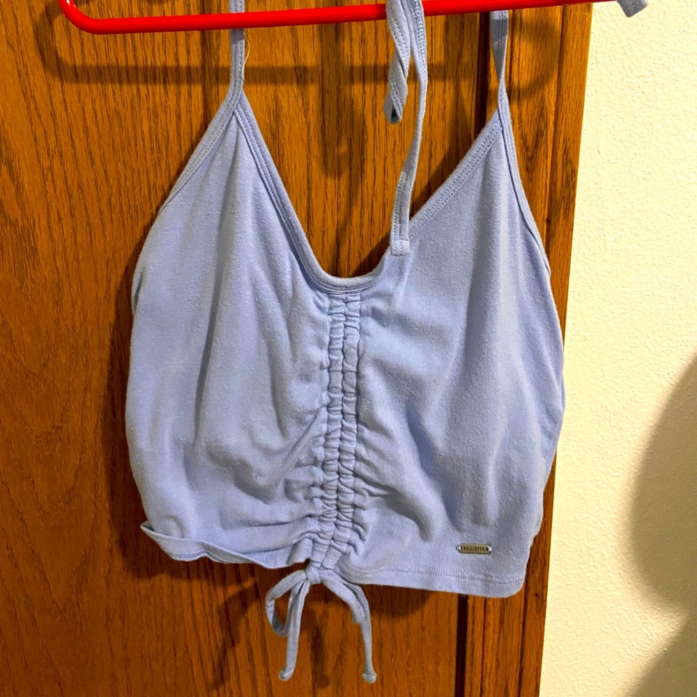 Hollister halter crop top with a ruched front and the neck string is adjustable.
